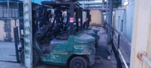 Forklift repair technician performing on-site maintenance in Ogun State industrial facility