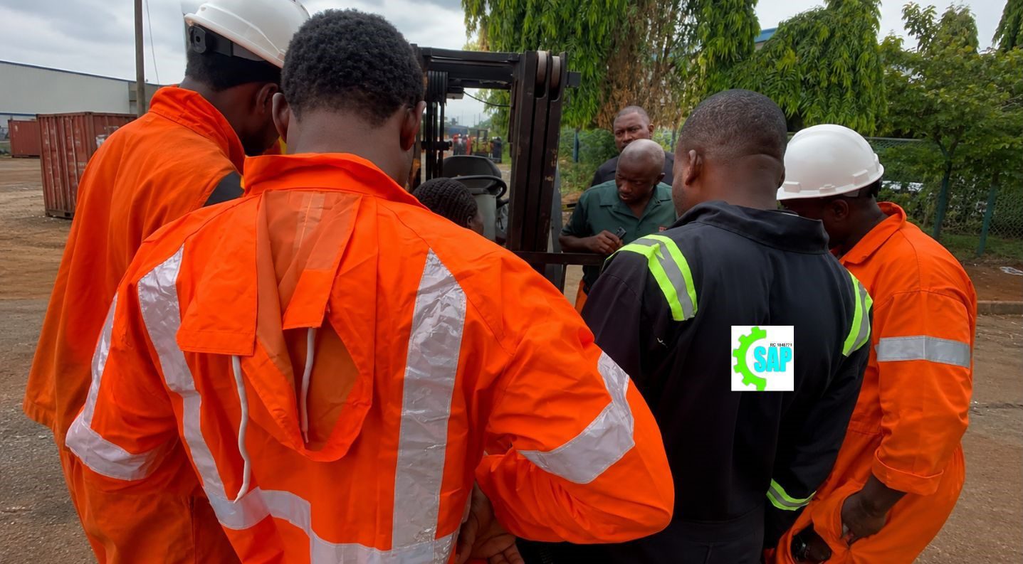 Forklift maintenance inspection team working at Apapa Port Lagos Nigeria industrial warehouse
